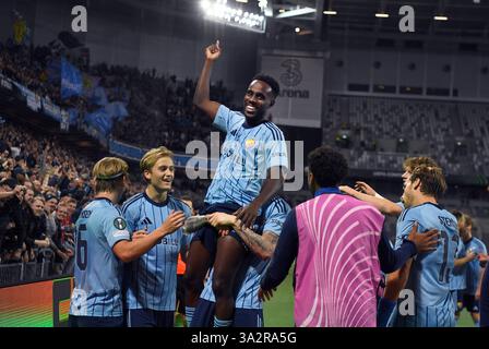 Stockholm, Sweden. 13th Mar, 2025. STOCKHOLM, SWEDEN 20250313Djurgården's Tokmac Nguen celebrates with his teammates after scoring 3-0 during the Uefa Conference League match, round of 16, 2nd leg, between Djurgården IF and Pafos at 3Arena in Stockholm, Sweden March 13, 2025. Photo: Oscar Olsson/TT/Code 12046 Credit: TT News Agency/Alamy Live News Stock Photo