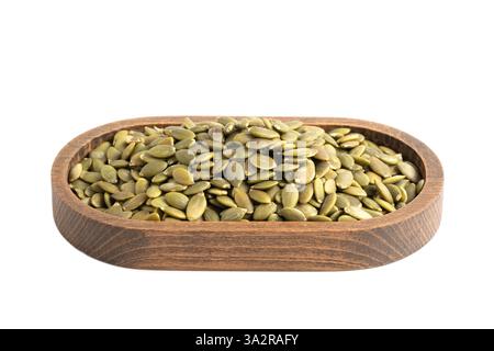Pumpkin seeds in wooden bowl isolated on white background. Clipping Path Stock Photo