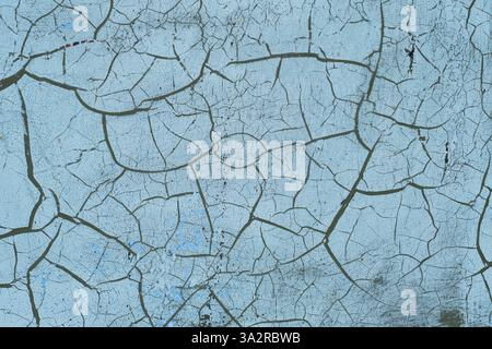 Grunge blue background with cracks and peeling paint. Abstract background Stock Photo