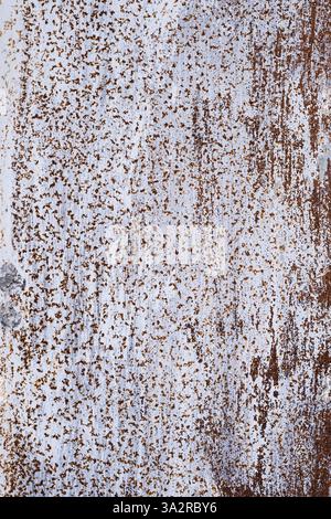 Background and texture of rusty metal painted with peeling white paint Stock Photo