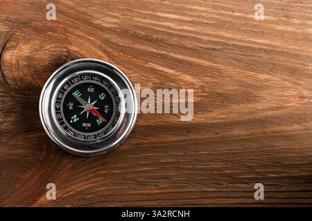 Compass on wooden background with copy space for your text Stock Photo