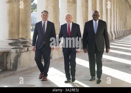 RETRANSMITTING CORRECTING LEFT TO RIGHT ORDER (left to right) Australian Defence Minister Richard Marles, Defence Secretary John Healey, and US Secretary of Defence Lloyd Austin ahead of the AUKUS Defence Ministers Meeting at Old Royal Naval College, Greenwich, London. Picture date: Thursday September 26, 2024. Stock Photo