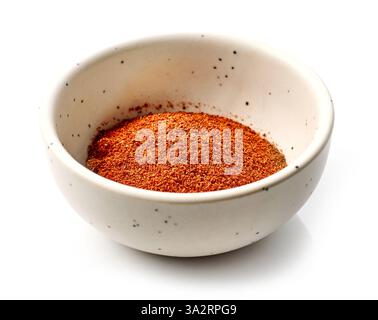 bowl of red paprika powder isolated on white background Stock Photo