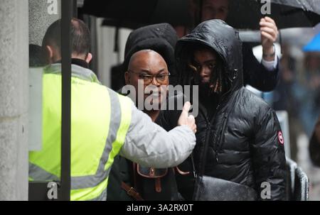 Prosper Kaba (centre), the father of Chris Kaba, arriving at the Old Bailey, central London, where Metropolitan Police firearms officer Martyn Blake is charged with the murder of Chris in south London on September 6 2022. Mr Kaba died after being shot once in the head through the windscreen of an Audi car in Kirstall Gardens, Streatham. Picture date: Monday October 14, 2024. Stock Photo