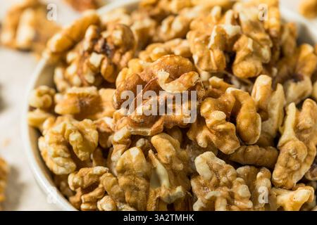 Organic Raw Walnut Halfs in a Bowl Stock Photo