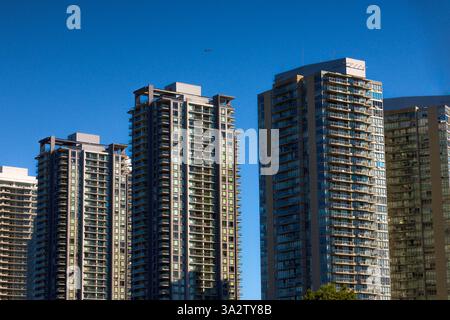 A striking urban skyline showcasing modern high-rise apartments ...