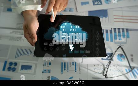 cloud service to document A businessman uses cloud technology to access, store, and share digital files securely. AI and cybersecurity tools ensure sa Stock Photo