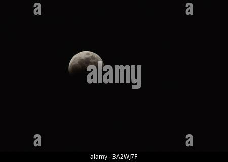 LEON, MEXICO - March 14 Moon phase during Total Lunar Eclipse on March 14, 2025 in Leon, Guanajuato. Mexico. (Photo by JVMODEL) Stock Photo