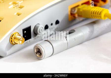 Close-up view of LAN network switch connectors with Ethernet cables attached. Isolated on a white background. Stock Photo