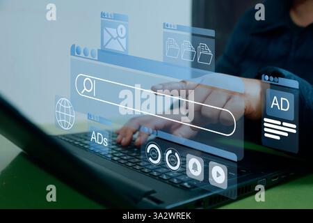 A person interacts with a digital interface displaying online advertisements, search bars, and data analytics, symbolizing modern digital marketing, o Stock Photo