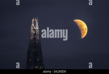Partial blood moon lunar eclipse over The Shard, London, 14th March ...
