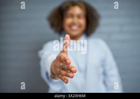 Close-Up of Hand Reaching Out for a Friendly Greeting and Connection Stock Photo