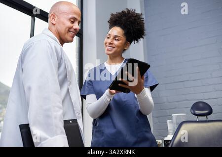 Smiling Team Collaboration of Healthcare Professionals in a Modern Office Setting Stock Photo