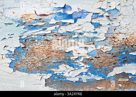 Layers of paint peeling from rusty metal Stock Photo