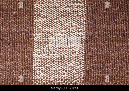 Brown and white striped fabric texture in a close up view Stock Photo