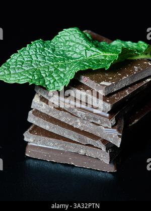 Chocolate and nut bars with a mint leaf Stock Photo