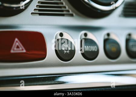 Car AC or air conditioning dashboard button and snowflake symbol. Close up shot, no people. Stock Photo
