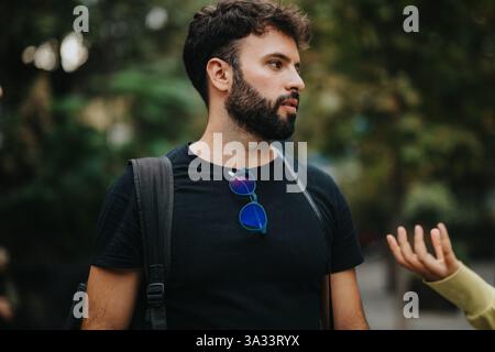 University students engaging with professor in outdoor discussion Stock Photo