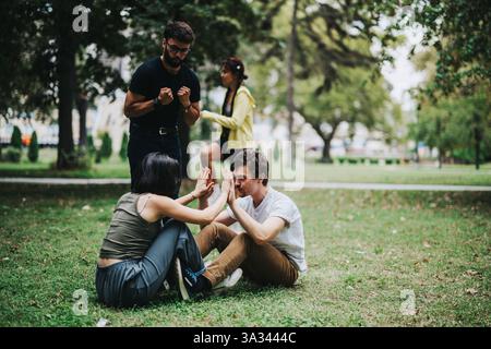 Students participating in an outdoor sports class with their teacher Stock Photo