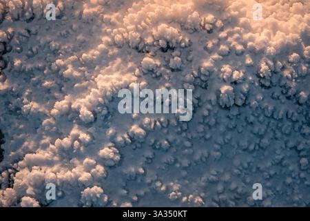 Close-up of snow textures at Siete Picos in Guadarrama Mountains, Madrid, capturing the intricate patterns formed by snow crystals in a pristine winte Stock Photo