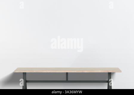 Minimalist wooden desk with black metal legs, empty workspace against a white-gray wall, perfect for office setups, product display, or creative works Stock Photo