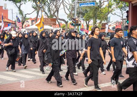 Micost College students marching on National Day parade in Malacca, Malaysia Stock Photo