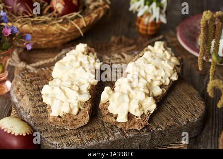 Two slices of bread with spread made of leftover Easter eggs in spring Stock Photo