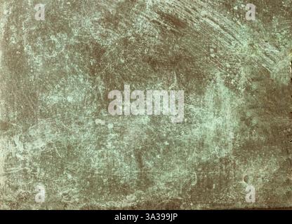 Close-up view of a weathered copper surface revealing the natural patina and corrosion effects Stock Photo