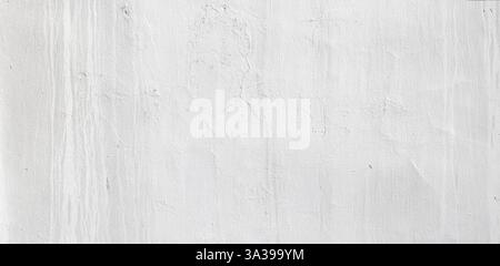 Textured white concrete wall background with brush strokes and imperfections, perfect for design projects Stock Photo