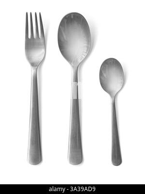 Stainless steel fork, spoon, and teaspoon arranged elegantly on a pristine white background, perfect for showcasing dining or kitchenware Stock Photo