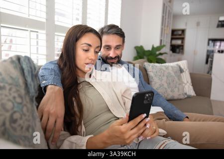 Couple using web service, app on smartphone for Internet communication Stock Photo