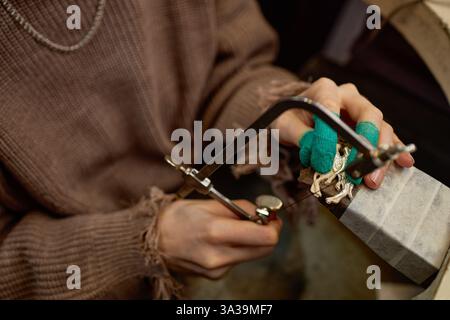 Hands of a craftsman working meticulously, shaping and creating intricate details. Focus on the meticulous crafting process and the skill required Stock Photo