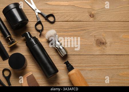 Modern trimmer and shaving accessories on wooden background Stock Photo