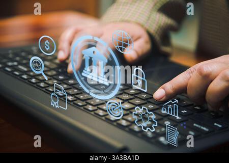 A conceptual image of online banking, showcasing a person typing on a keyboard with digital icons representing security, finance, global connectivity, Stock Photo