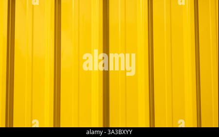 Bright yellow metallic slate texture with vertical protrusions. suitable for construction and industrial themes. Stock Photo