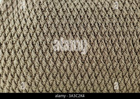 Full of screen light brown knitted bag. Vertical shooting. Stock Photo