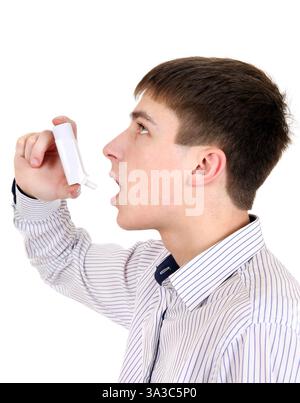 Teenager using Inhaler Isolated on the White Background Stock Photo
