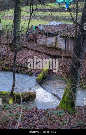 an old wooden dam and a small stream Stock Photo - Alamy