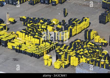 Lots of brand new yellow bins for recycling waste in a yard. Yellow bin. Plochingen, Baden-Wuerttemberg, Germany, Europe Stock Photo