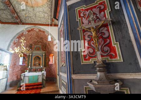 Interior and altar, walls with colourful frescoes in the Romanesque fieldstone church in the village of Raben, Rabenstein, Flaeming, Brandenburg, Germ Stock Photo