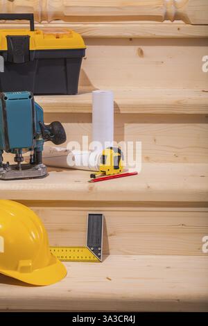 Working tools on setps of wooden ladder Stock Photo