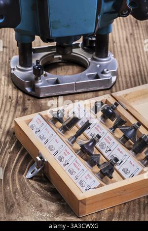 Woodworking tools - roundover router bits in wooden box and plunge pouter Stock Photo