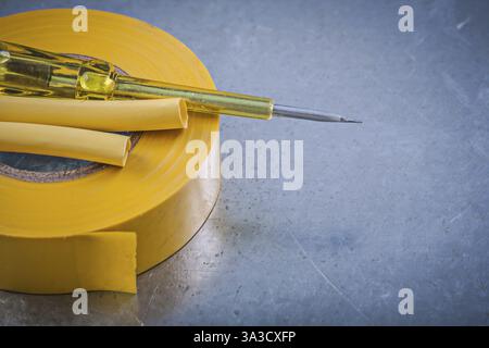 Yellow insulating tape electric cables insulated turnscrew construction concept Stock Photo