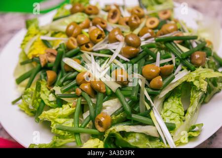 Fresh salad of olives, lettuce and green beans Stock Photo