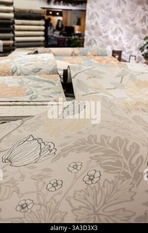 Rolls of wallpaper on a table Stock Photo