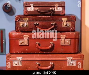 Stack of four vintage suitcases Stock Photo