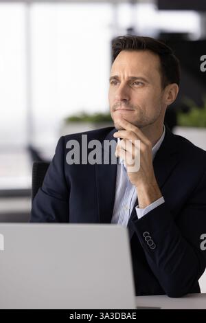 Serious thoughtful executive man thinking on company management Stock Photo