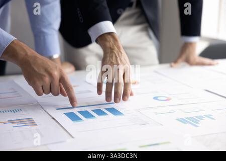 Hands of two businessmen analyzing business sales report Stock Photo