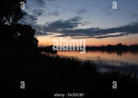 Sunset sky, white pink clouds and blue sky. Stock Photo