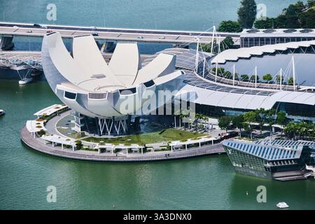 Singapore - August 14, 2024: Futuristic architecture Lotus shaped  design of the Art Science museum located in front of Marina Bay Sands Stock Photo
